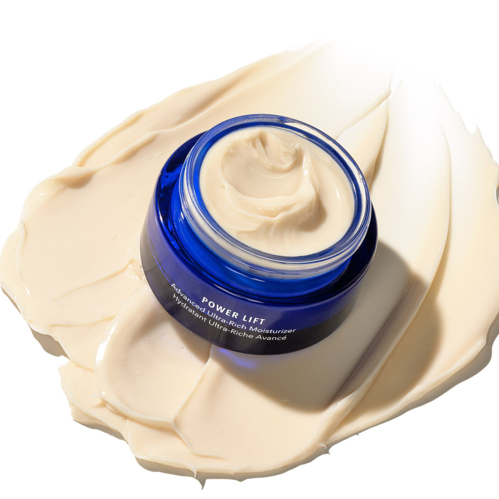 Blue jar of cream labeled 'Power Lift' on a white background